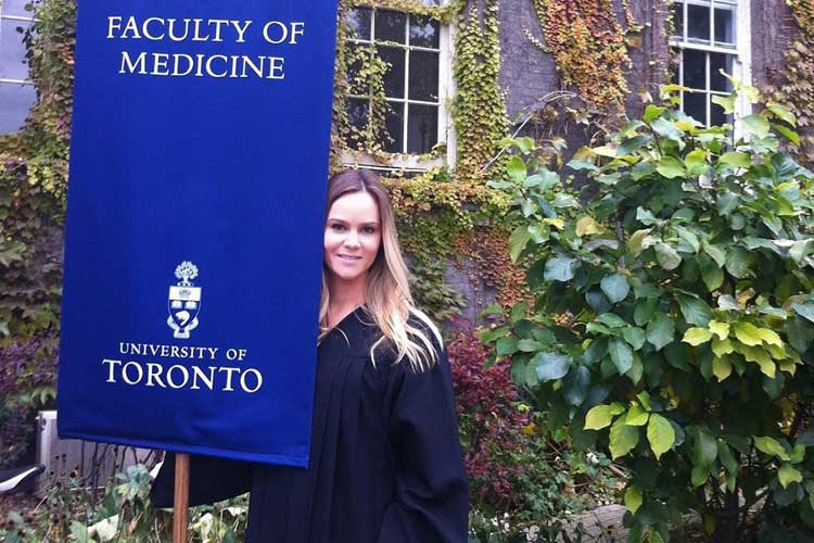 photo of Blakely holding a banner