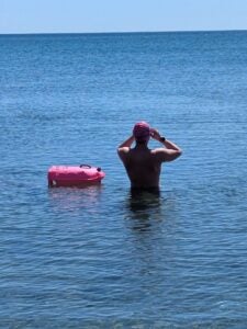 Lev Goldberg look out across Lake Ontario while in the water