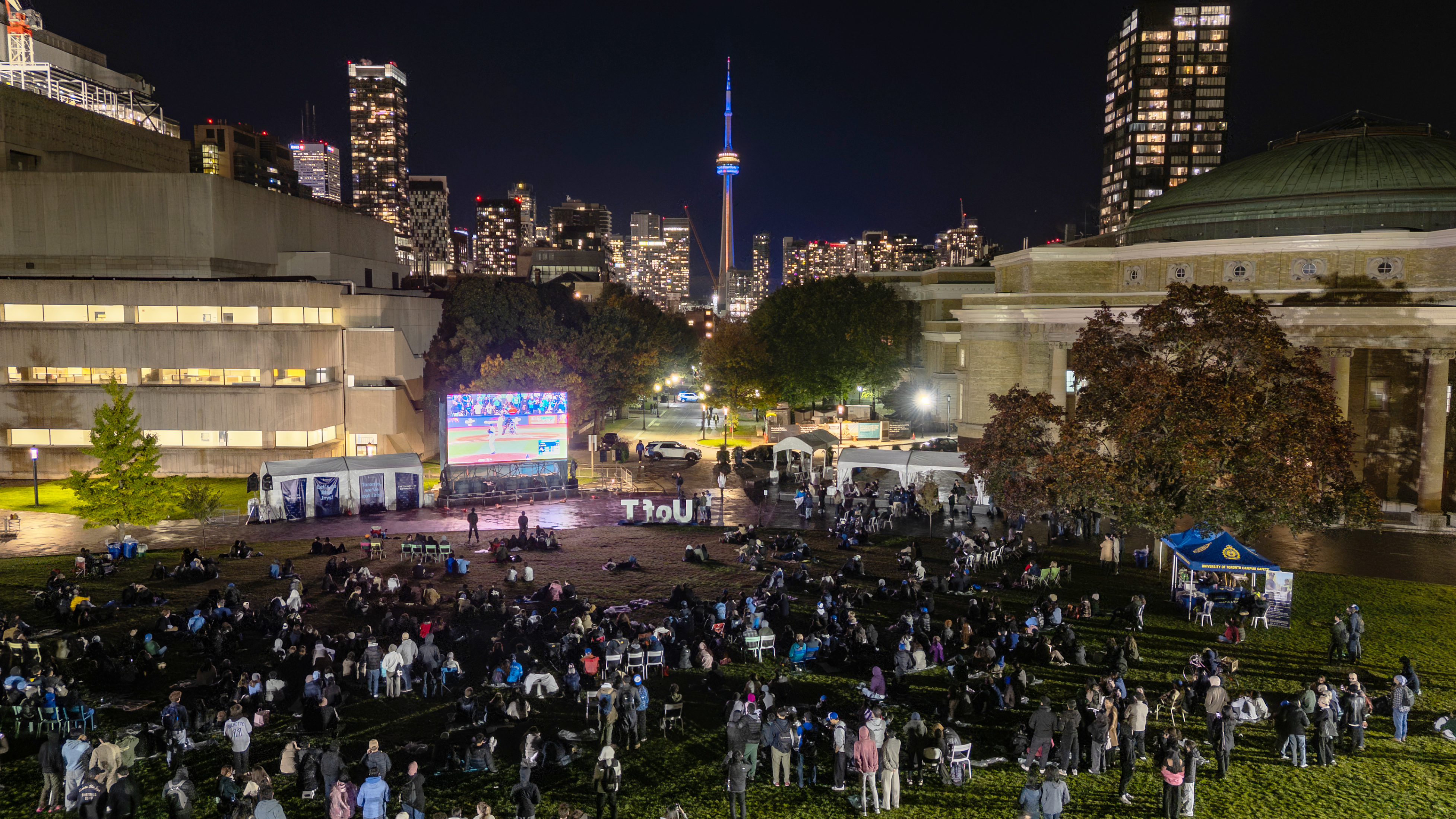 A large crowd gathers at night on Front Campus