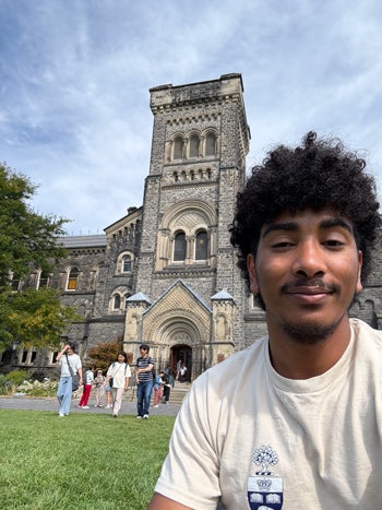 Grayson Graham takes a selfie in front of University College