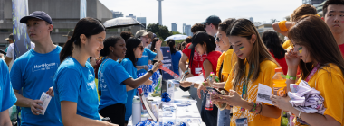 Students talk to a representative at the clubs fair on Front Campus