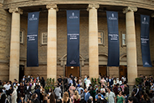 Convocation Hall exterior with a crowd out front