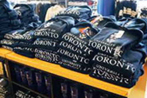 A display of folded U of T sweatshirts