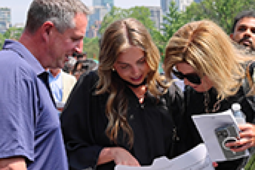 A family surrounds a graduate