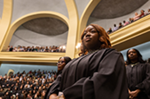 A student stands in Convocation Hall