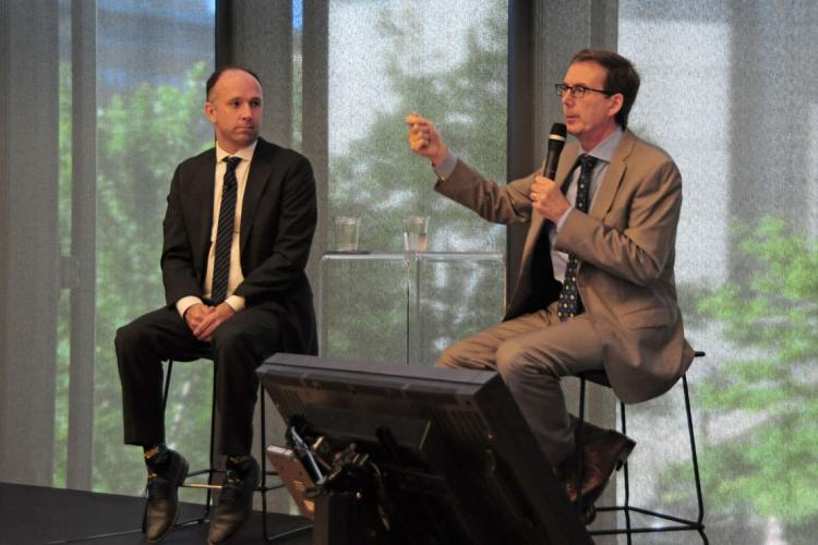 Tiff Macklem and Jamison Steeve presenting to an audience 