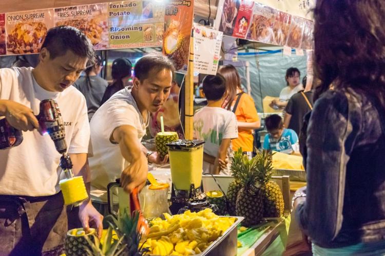 People sampling food at the Taste of Lawrence vent