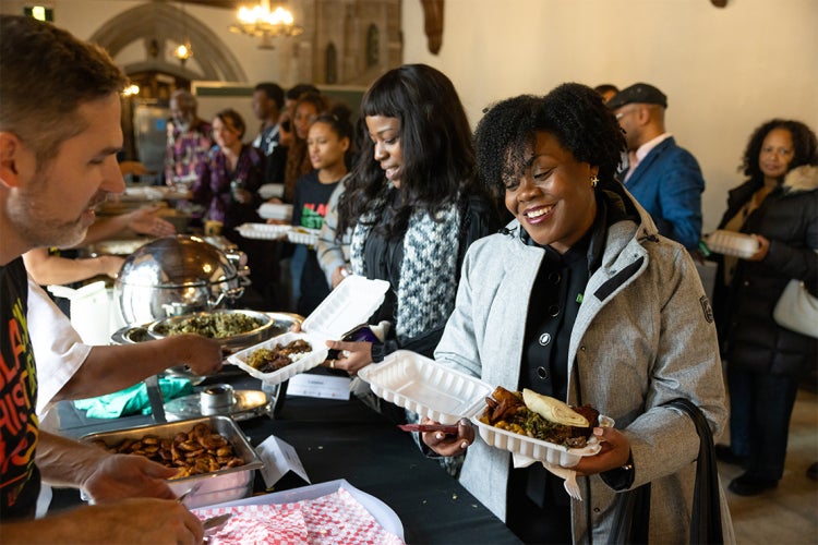 people in line to be served food at the 2025 Black history month luncheon