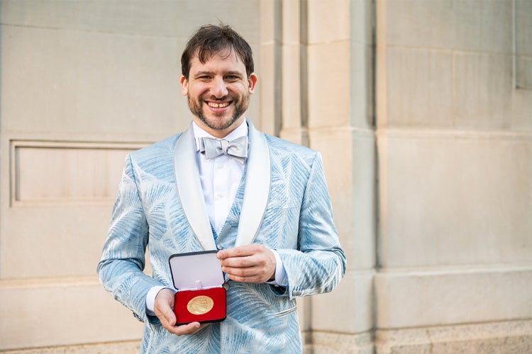 Jacob Tsimerman holds the Fields Medal