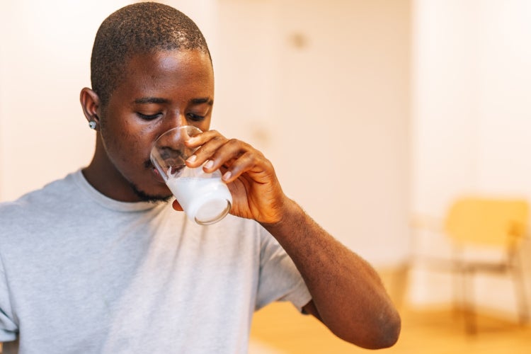 Young man drinking milk