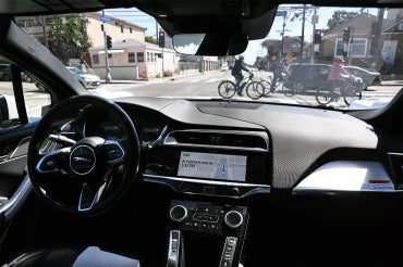 waymo car as seen from the interior, driving around los angeles
