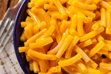 close up view of a bowl of macaroni and cheese