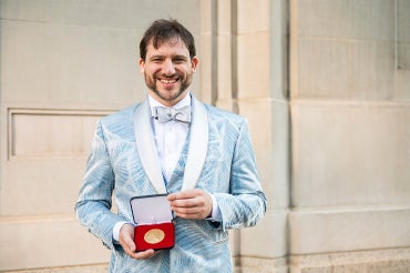 Jacob Tsimerman holds the Fields Medal