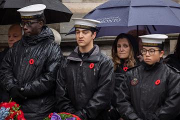 Photo of Chrystia Freeland standing under an umbrella