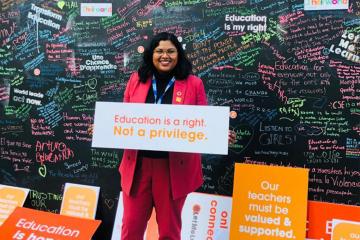  Anjum Sultana pictured at the UN holding a sign saying "Education is a right. Not a privilege"