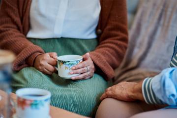 A woman holding a mug.