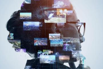 A composite image of a woman's head with multiple screens floating above it.