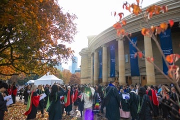 outside convocation hall with fall leaves on the trees visible