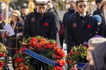 cadets hold a wreat from the University of Toronto during remembrance day