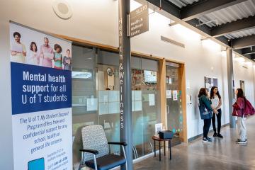 students stand outside the Health and Wellness Centre at UTSC