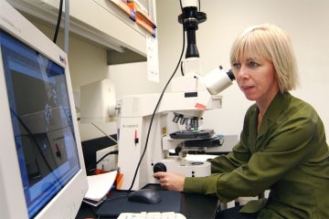 Portrait of Freda Miller in a lab at the Hosptial for Sick Children