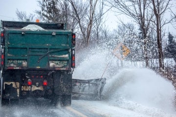 Snowplow plowing snow on a Peel Region street
