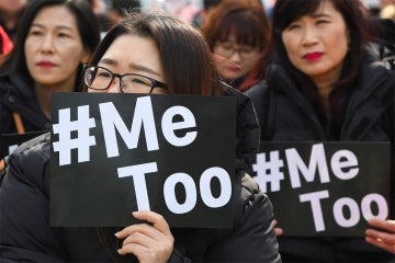 South Korean demonstrators hold banners during a rally to mark International Women's Day