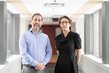 Robert Kozak and Samira Mubareka stand in a hallway
