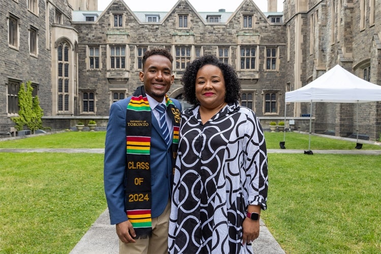 Meshach Homer poses with his mother in the Hart House quad