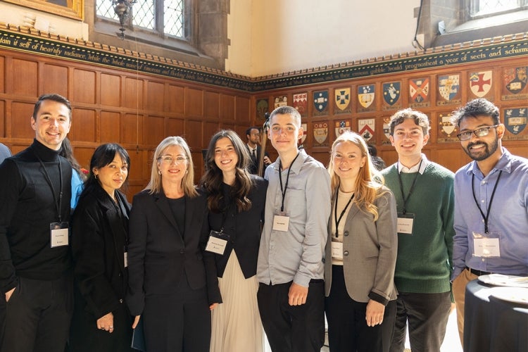 Woodin takes a group shot that includes both&nbsp;her family and members of her lab