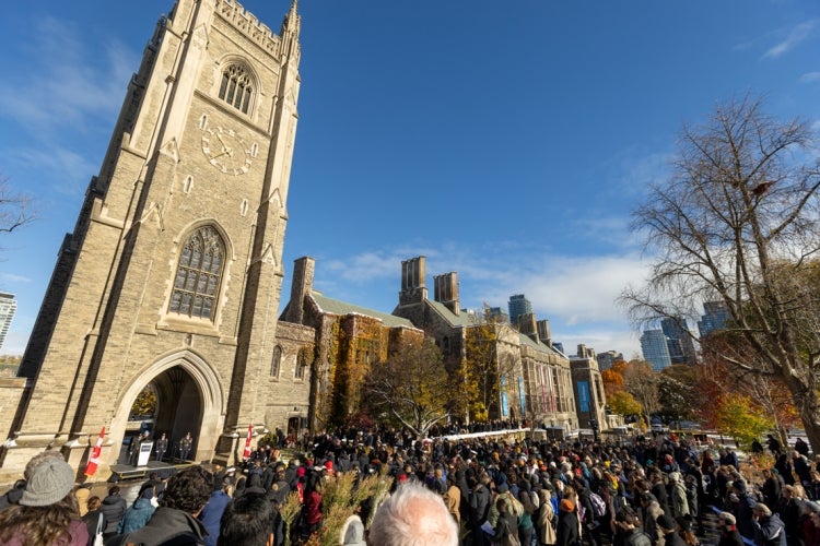 a large crowd gathers in front of soldier's tower